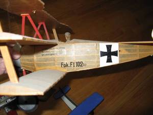 lot 83 image: Authentic Replica WWII German Biplane, Kaleidoscope Plane, and Hubley Navy Fighter Plane