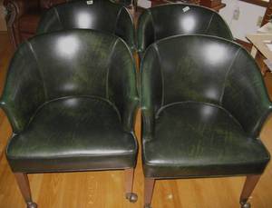lot 102 image: Set of 4 of Dark Green Leather or Naugahyde Chairs on Casters