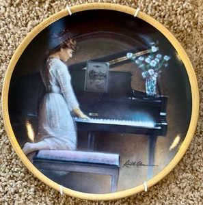 lot 118 image: Two Robert A Olson Collectible Plates, Piano Moods and Young Flutist