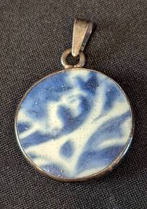 lot 48 image: Three Sterling Silver Pendants including a Sterling Silver and Larimar Pendant