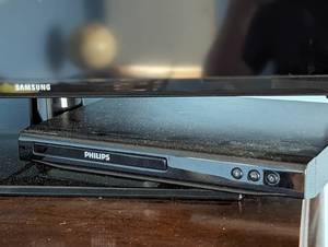 lot 156 image: 28 Samsung TV and Philips DVD Player