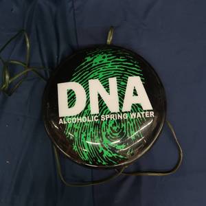 lot 12 image: DNA ALCOHOLIC SPRING WATER SIGN