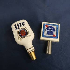 lot 86 image: MILLER LITE AND PABST BLUE RIBBON TAP HANDLES