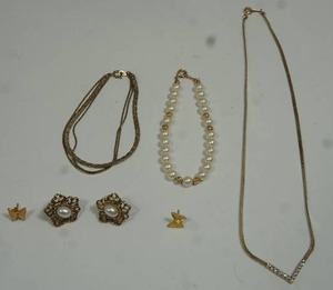 lot 52 image: Collection of Vintage Avon Jewelry...Avon Signed Pearl and Gold Tone Bead Bracelet and Multi-Chain Gold Bracelet, Gold Butterfly and Faux Opal Oval Pierced Earrings, Chevron Gold Necklace...