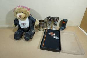 lot 236 image: Assorted Harley Davidson Novelties - Bear, Dog Toy, Glasses, Map Portfolio