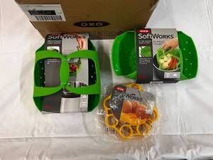 lot 279 image: 7 Piece OXO Softworks Silicone Steamers, Egg Racks