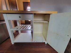Wood top shelf on wheels.