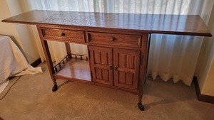 lot 13 image: Thomasville Oak Drop-Leaf Bar Server on Brass Casters