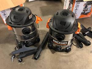 lot 1 image: Lot of 2 RIDGID 10 Gallon 6.0 Peak HP Stainless Steel WetDry Shop Vacuum with Filter, Locking Hose and Accessories Customer Returns See Pictures