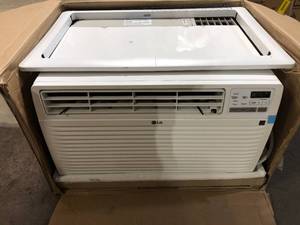 lot 48 image: LG 9,500 BTU 230V Through-the-Wall Air Conditioner LT1036CER Cools 450 Sq. Ft. with remote in White  Customer Returns See Pictures