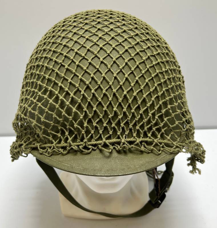 lot 46 image: WWII U.S. Military Helmet With Netting