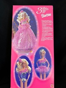 lot 24 image: Barbie 3 Looks New in Box 1994