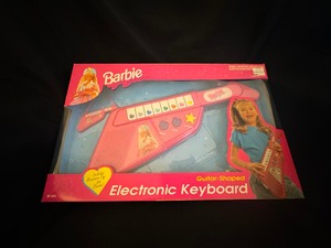 lot 33 image: Barbie Guitar Shaped Electronic Keyboard New in Box