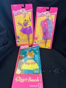 lot 144 image: A Lot of Three Vintage Barbie Outfits New in Package.