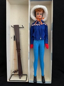 lot 191 image: Vintage Barbie Outfit #948 Ski Queen 1963-1964 on 1962 Midge Doll with Stand.