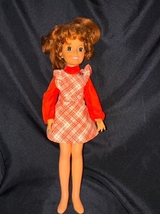 lot 242 image: Vintage Chrissy Doll with Original Clothes Hair Grows And Grows.