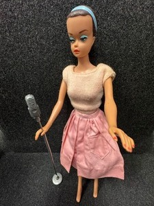 lot 308 image: Vintage Molded Hair Barbie with Mic