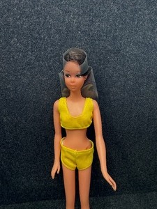 lot 315 image: 11 (28 cm.) having long straight brunette Hair, Straight Legs, Wearing Yellow two-piece Suit 1966 Taiwan.