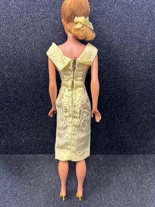 lot 317 image: Vintage Barbie Wearing Yellow Silk Sheath Park Dress.