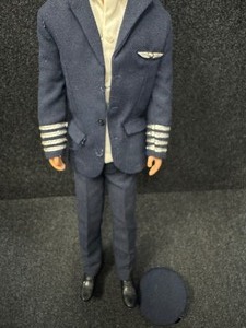 lot 329 image: Early Flock Hair Ken Doll American Pilot Uniform, Wings, Shoes.