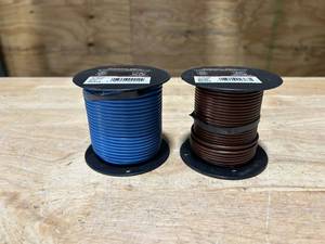 lot 52 image: PRIMARY WIRE Lot of 2 Spools of Wire- 14 Gauge and 16 Gauge (100 feet each)