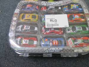 lot 35 image: 24-Pc. Racing Cars Case open box , ...