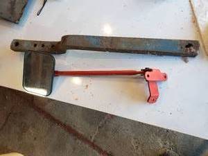 lot 74 image: vintage truck mirror and a draw bar believed to be out of a 8n ford tractor