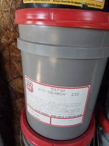 lot 107 image: new unopened 5 gal bucket of ATF-DEXRON oil