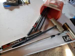 lot 197 image: CHAMPION windshield washer jug and assortment of squeegees