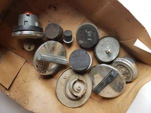 lot 232 image: various fuel caps and expansion plugs
