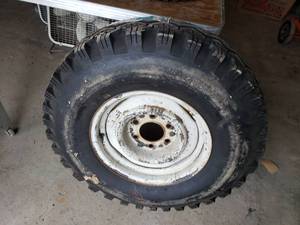 lot 248 image: NEW SUMMIT TIRE mounted on a 5 bolt rim tire size L78-15