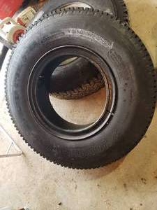 lot 250 image: NEW YOKOHAMA truck tire mounted on rim tire size 9.00R20