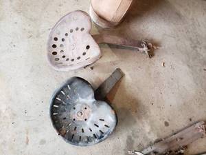 lot 352 image: (2) metal tractor seats