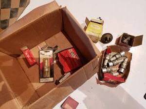 lot 416 image: assortment of new spark plugs and thermostats