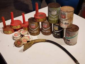 lot 442 image: an assortment of old oil cans, oil can spouts and barrel caps