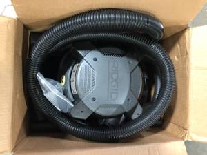 lot 15 image: RIDGID 4 Gallon 6.0 Peak HP WetDry Shop Vacuum with Detachable Blower, Fine Dust Filter, Locking Hose and Accessories Customer Returns See Pictures
