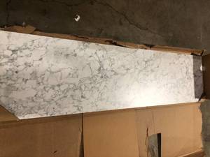 lot 28 image: THINSCAPE 8 ft. L x 25 in. D Engineered Composite Countertop in Volakas Marble with Satin Finish   Customer Returns See Pictures