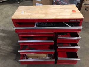 lot 8 image: Husky 42 in. W x 18.1 in. D 8-Drawer Red Mobile Workbench Cabinet with Solid Wood Top   Customer Returns See Pictures