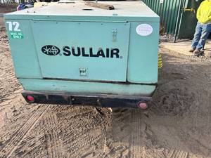 Green sullair trailer air comp.