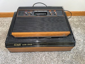 lot 112 image: RARE FIND ATARI CX2600A (ATARI GAME CENTER ORG 700) GAMES, MANUALS, CONTROLLERS, PADDEL & TV ADAPTER