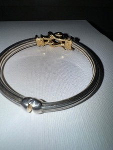 lot 1 image: ELEGANT 14K GOLD & 925 STERLING SILVER BRACELET WITH DIAMOND ACCENTS