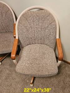 lot 34 image: Caster Co. Swivel Armchairs