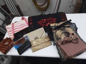 assorted purses and handbags
