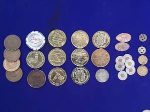 State Park medallions and bus tokens.