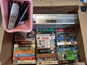 Philips VHSDVD combo with assorted VHS tapes and remotes