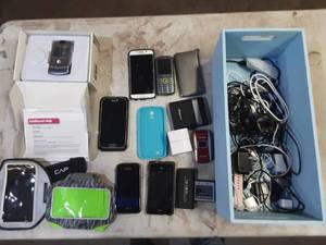 assorted cell phones, chargers, power banks, more
