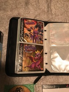 lot 571 image: Carrying Case with PlayStation 2 Video Games & PlayStation Manuals