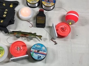 lot 603 image: Sunflower heater, boot grips, line, minnow bucket, tackle boxes, spearing decoy w hook, rattle ice fishing reels and more