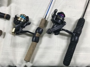 lot 606 image: ice fishing rod and reels and ice scoop