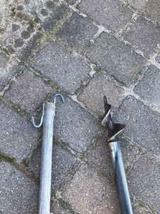 lot 665 image: Dock post with Auger Bit and pole with 2 hooks for retrieving Items.  